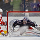 Image for article titled Newspaper Photograph Of Hockey Game Highlighted By Fan's Blowjob Pantomime